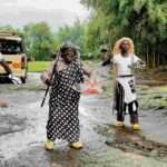 The Four Rwandan men welcome the visitors in the gorilla-guardian-village