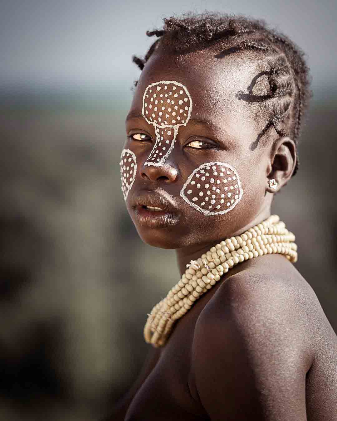 Portrait of a young Karo woman from Omo Valley, Ethiopia