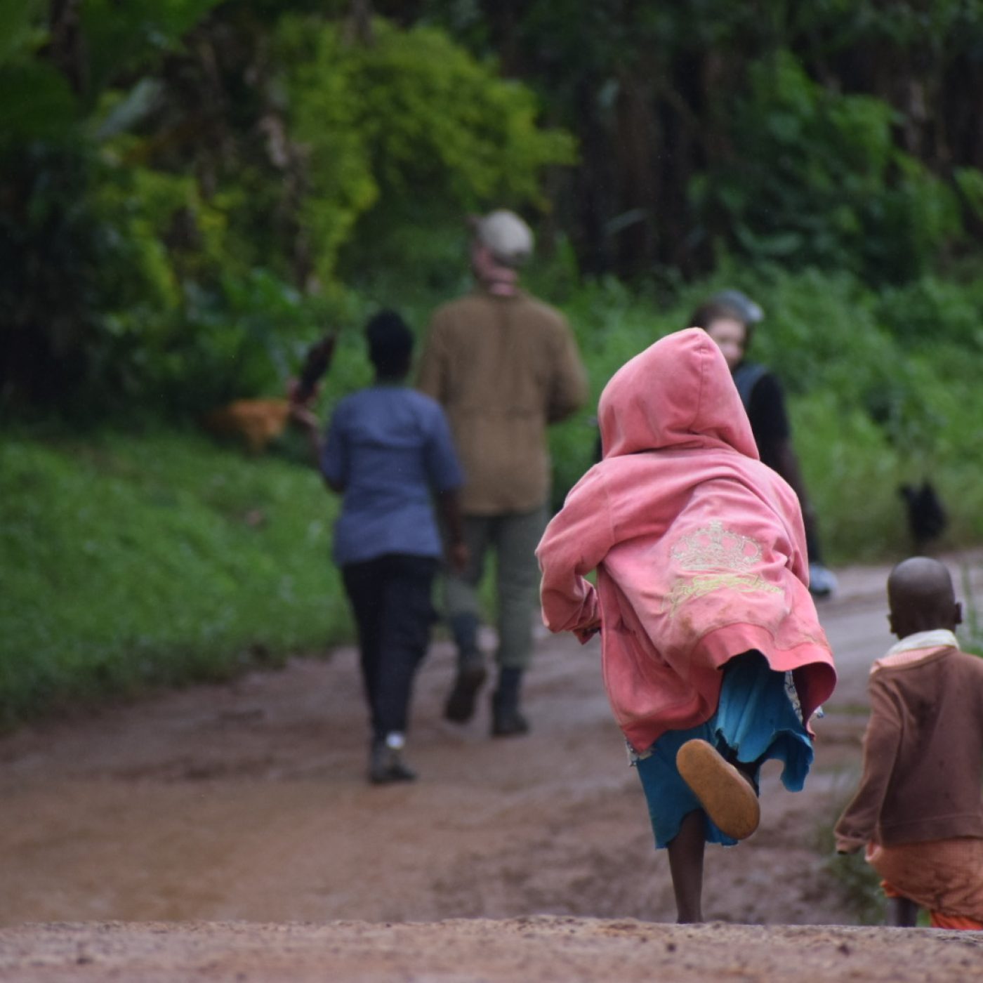 Kids around Kibale forest happily running back home after school